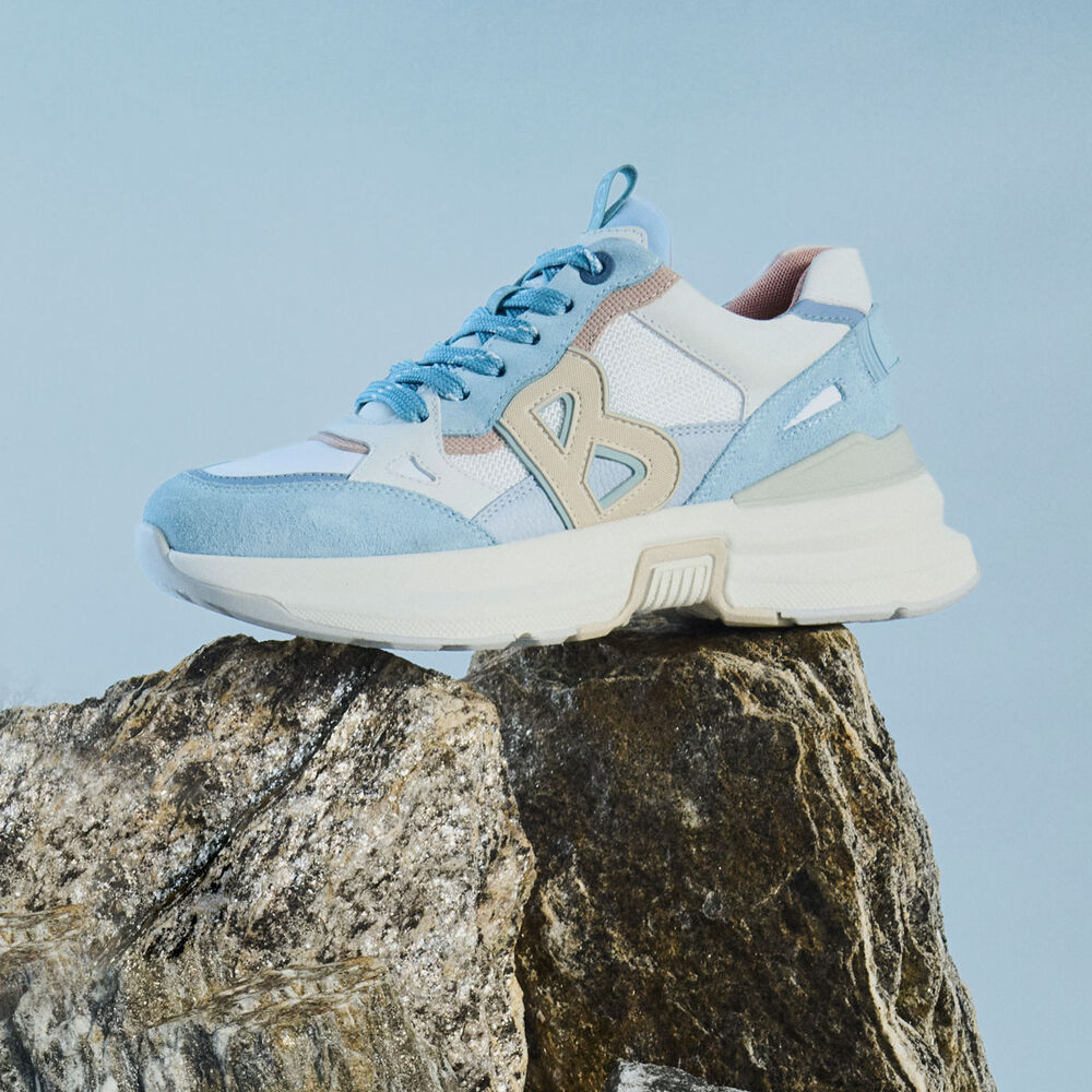 Side view of the BOGNER City Trail Performance trainer in light shades of blue, brown and beige.