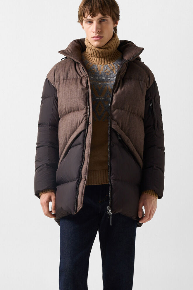 The other male model wears the Jones short down coat in brown, a BOGNER Jacket, paired with the Roxter cashmere sweater and Travis straight-leg jeans in dark blue.