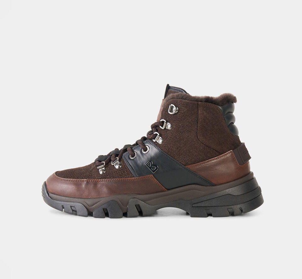 The image shows the dark brown Copper Mountain high-top trainers in an urban mix of materials, featuring textured suede and smooth detailing.