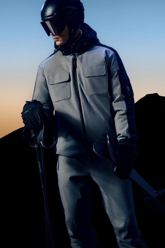 The Cobeyn ski jacket in grey and black is shown here with the matching Wido trousers and ski accessories.