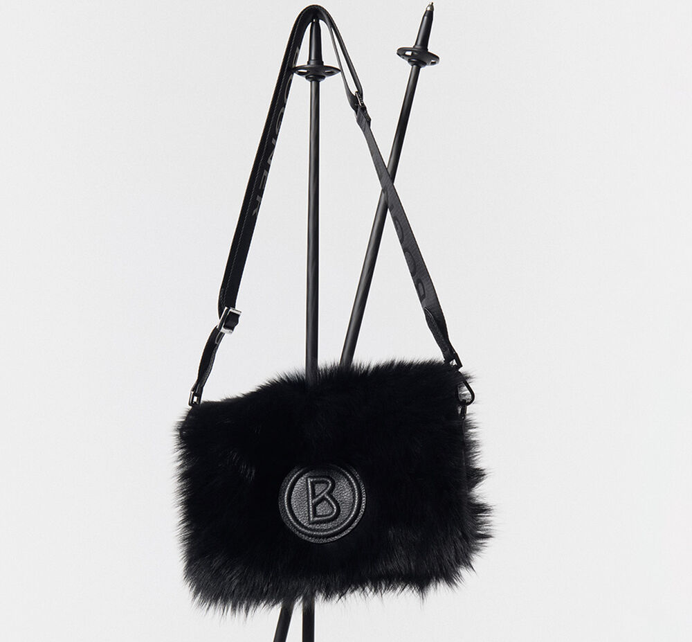 On this image you can see a black shoulder bag with the B logo and fur trim.