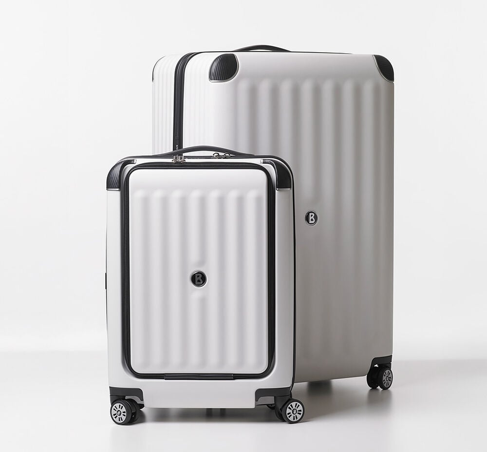 Two suitcases from the BOGNER Luggage Collection. The deluxe version at the front is shown in a smaller size.