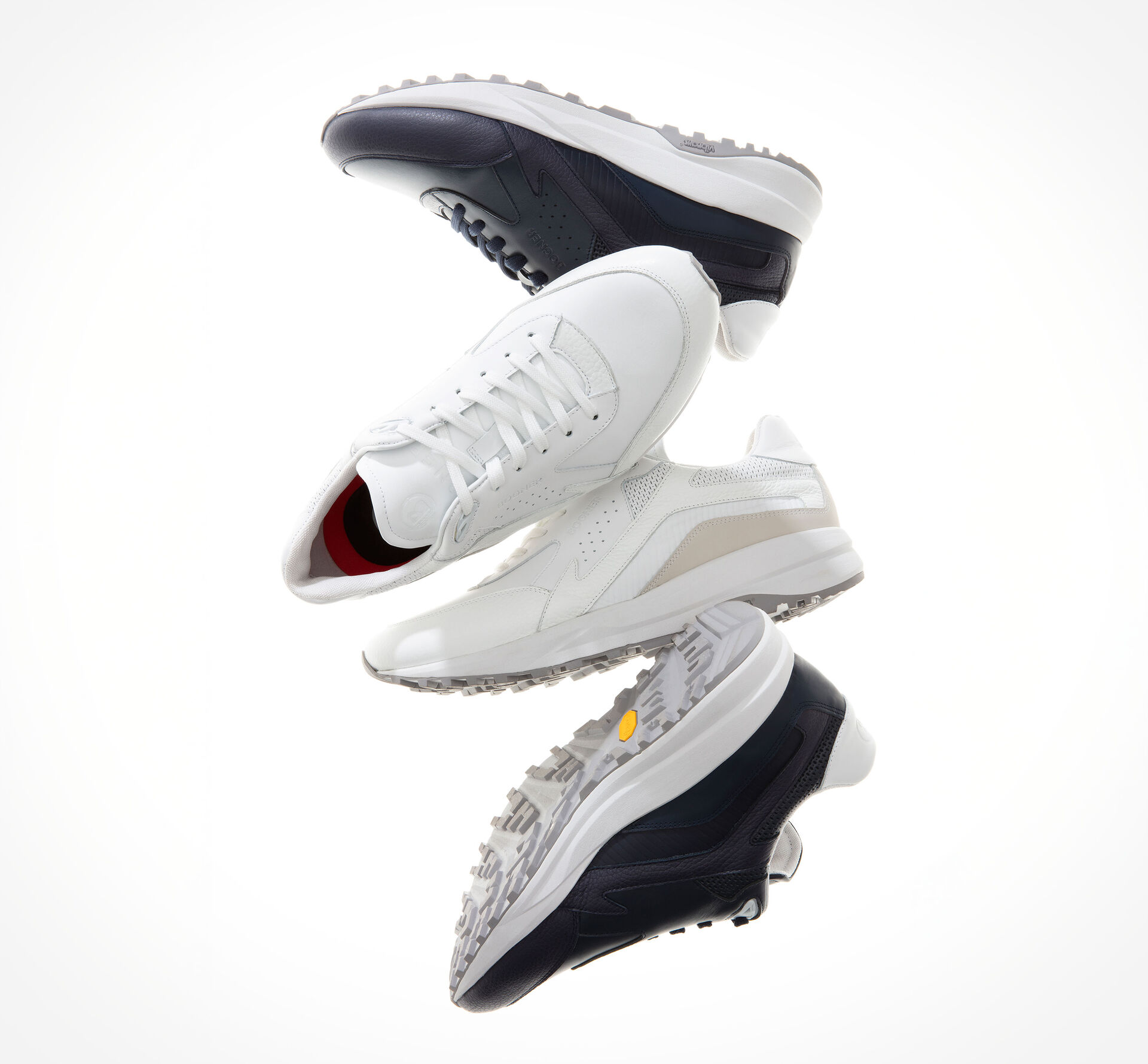 Übereinander angeordnete Golf Sneaker in verschiedenen Farben erwecken einen dynamischen Eindruck.
