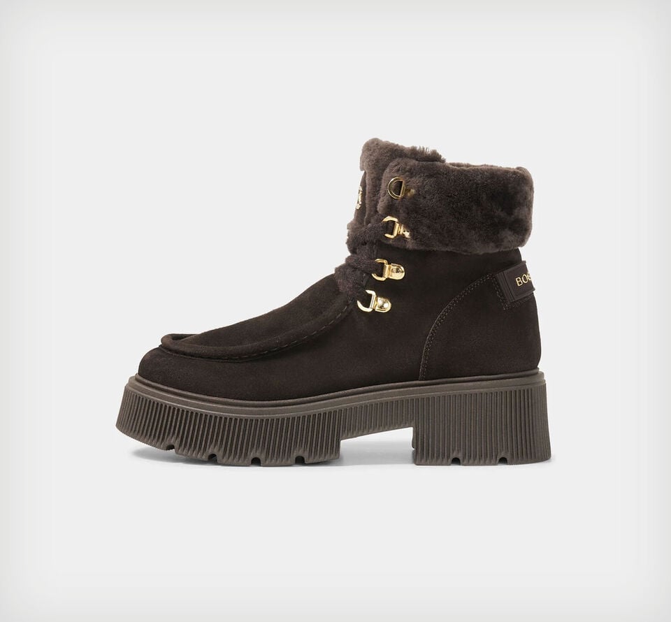 Crafted from dark brown suede, the Turin mid boots are elevated by gold-tone accents and soft shearling details.