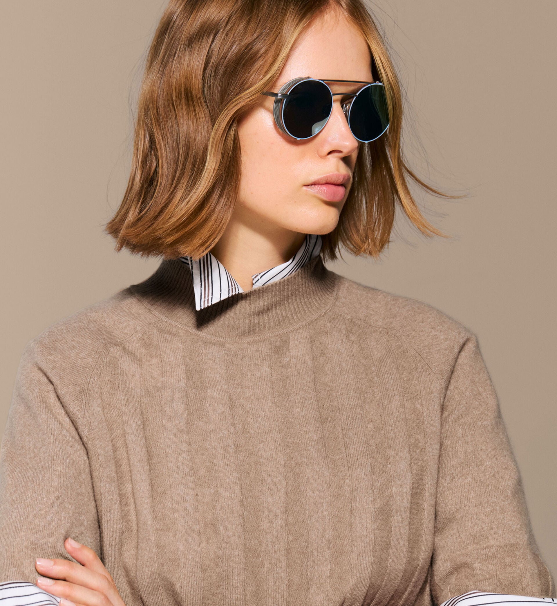 The female model is wearing a Misty long-sleeved blouse under the embroidered lightweight Stacey shirt and the graphically quilted Sally vest in camel.