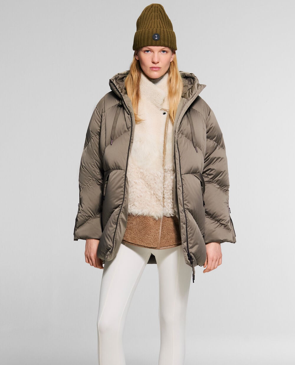 The model is wearing the Glenda jacket over the Lexy gilet combined with the Kaela trousers.