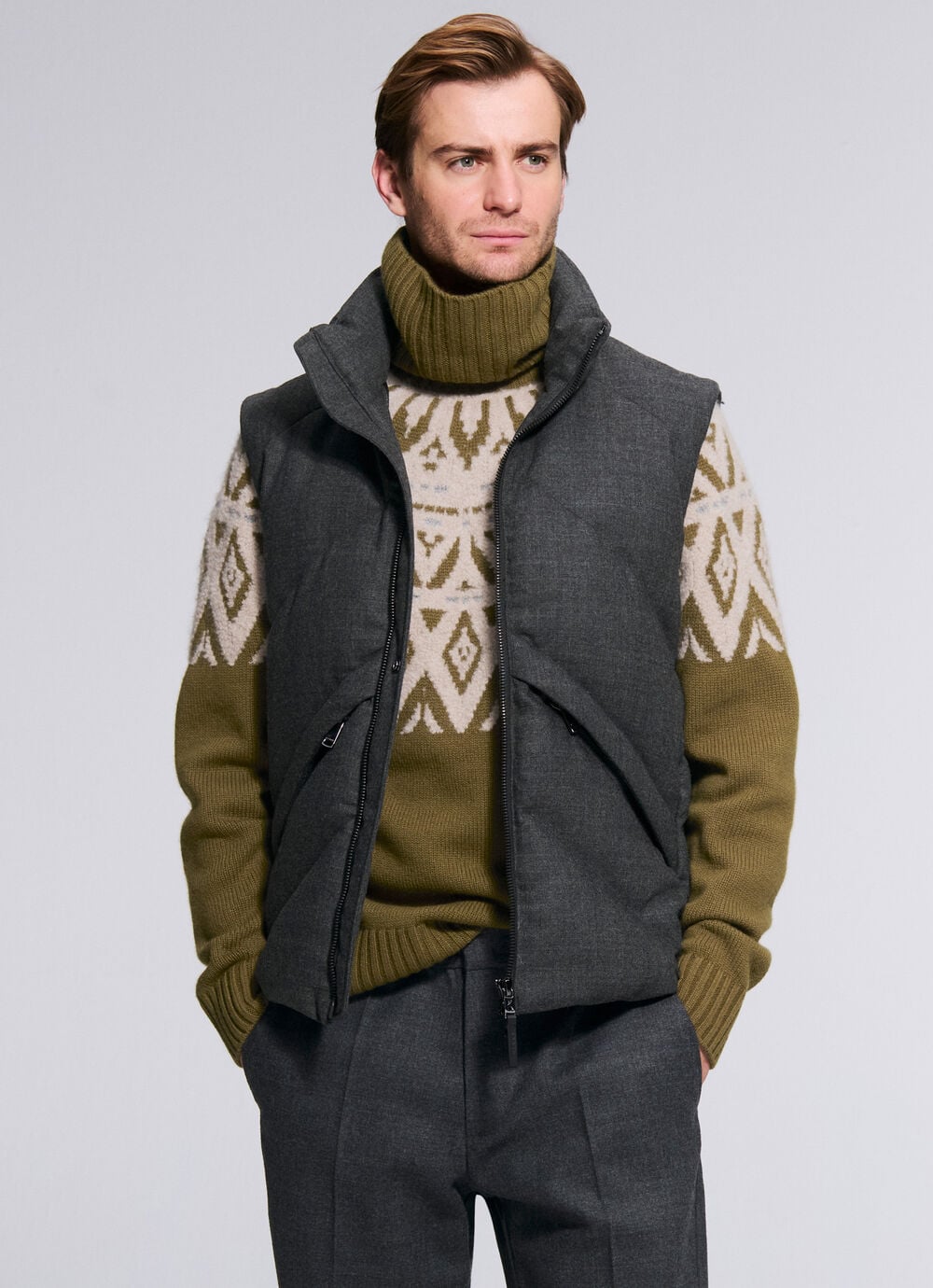The male model is wearing the Roxter Norwegian pullover in olive green under the Kendo gilet. Willy trousers and Antwerp shoes complete the look. 