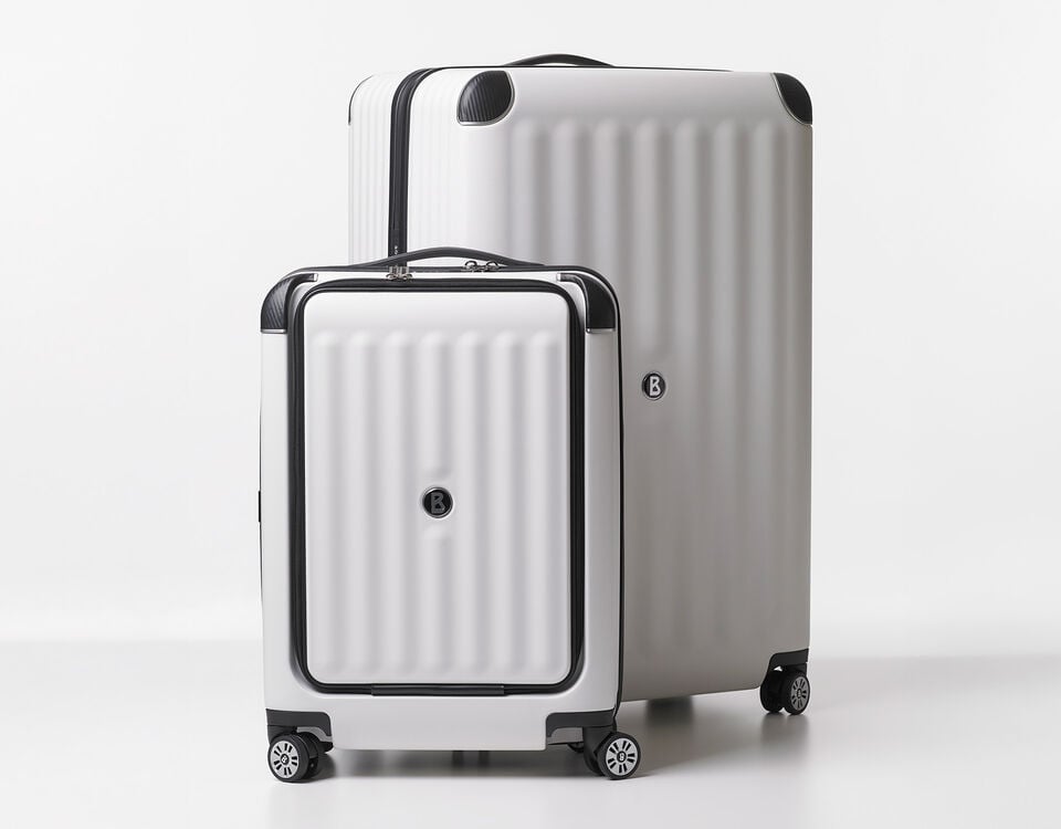 Two suitcases from the BOGNER Luggage Collection. The deluxe version at the front is shown in a smaller size.