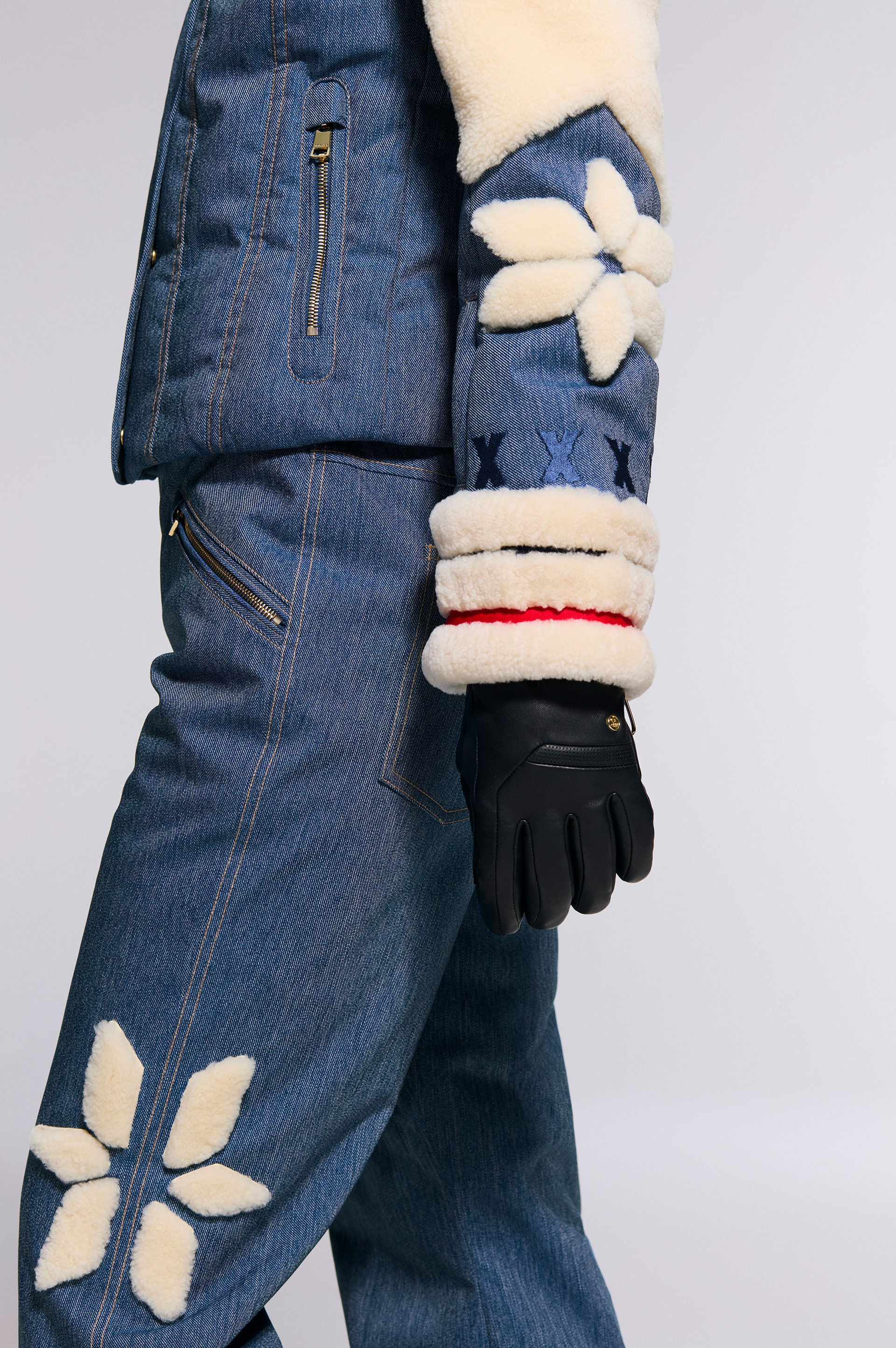 This image shows the Fina jacket and the Fena ski trousers made from technical denim with shearling details.