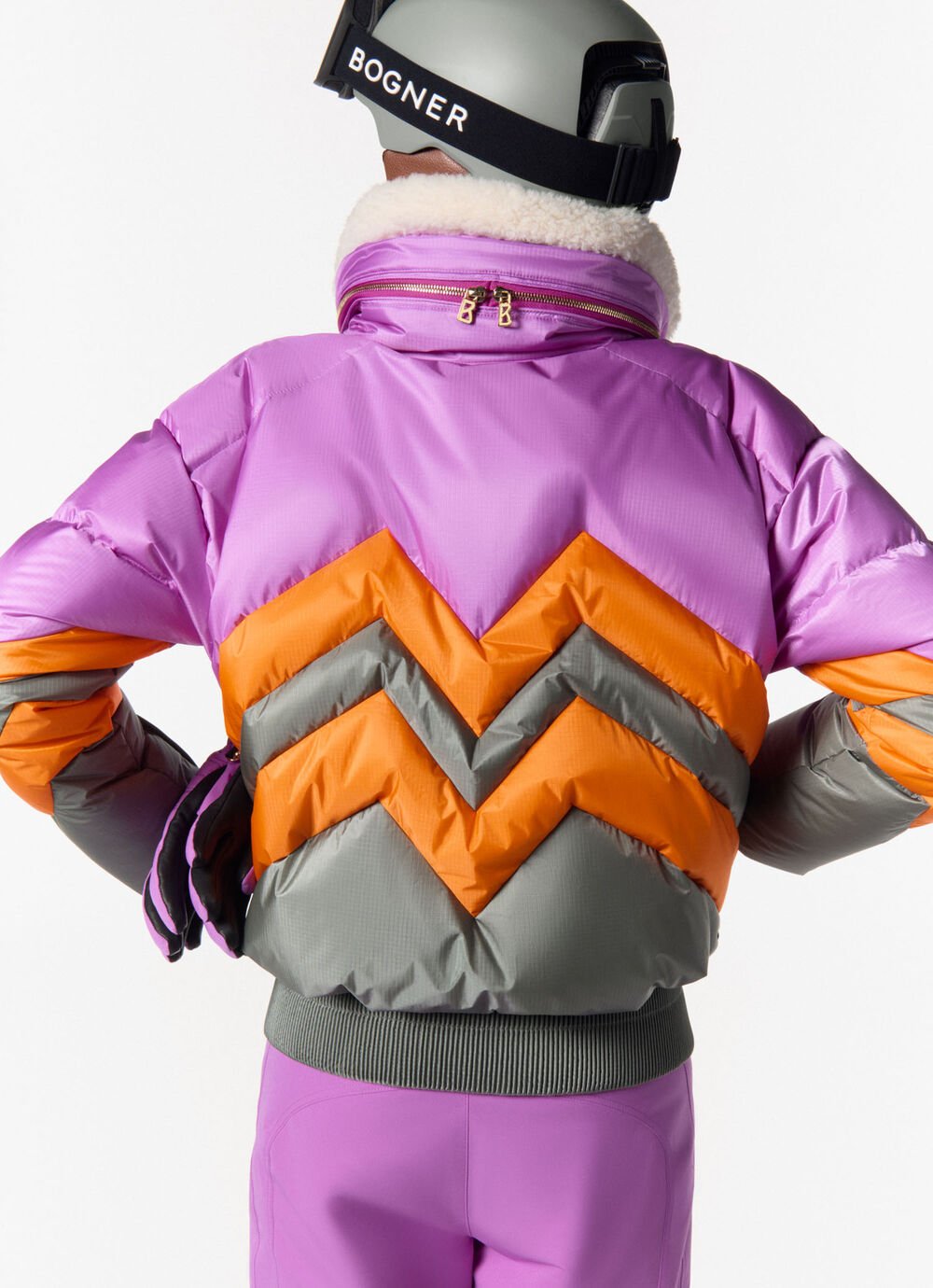 Rear view of the Valea down ski jacket with W quilting in a multicoloured look.