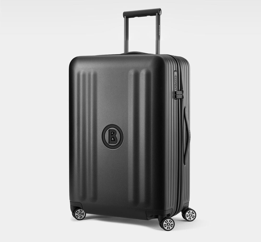 The Piz Large hard-shell suitcase in black from the Luggage Collection, with 360° spinner wheels and adjustable telescopic handle.