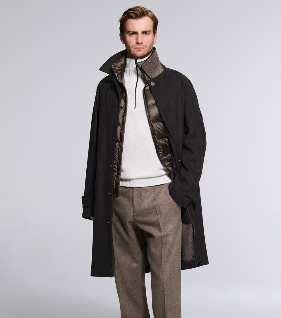 The model is wearing the Tilo double-faced coat in cashmere and virgin wool over the Holger gilet.