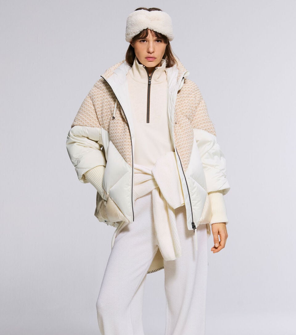 The model is wearing a light-coloured look defined by the Sheryl jacket and Andermatt shoes.