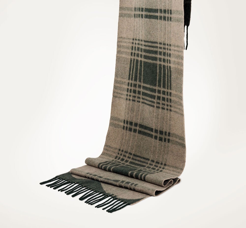 A checked scarf in green and beige, finished off with fringes.