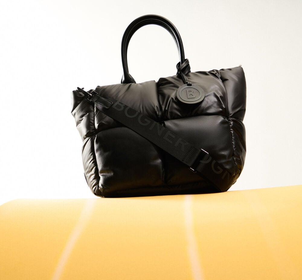 A voluminous quilted shopper in black, with B appliqué and logo shoulder strap.